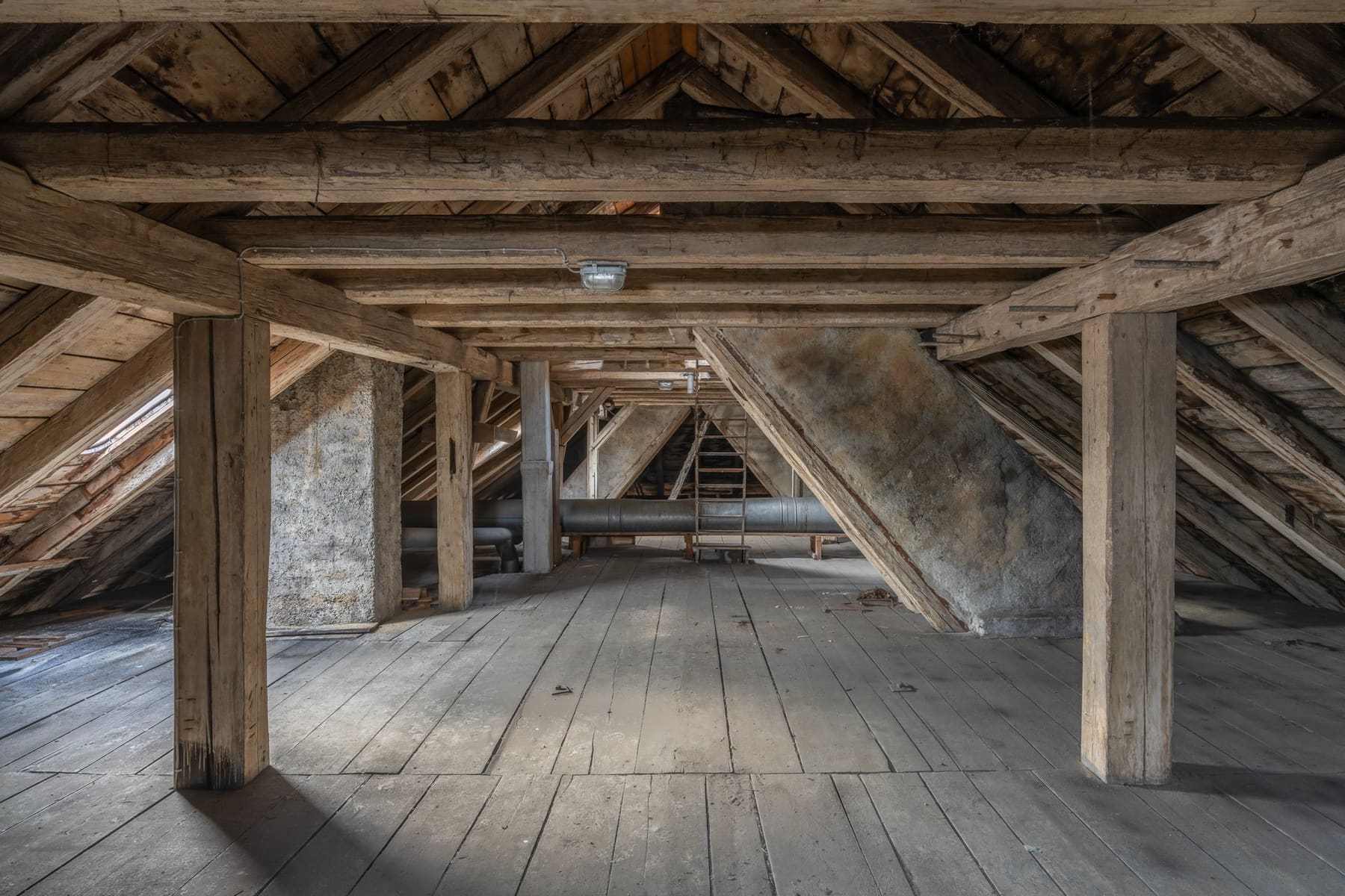 Carpenter working on an exposed roof structure